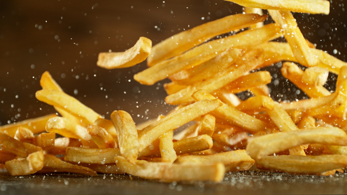 French fries - fried potatoes flying.